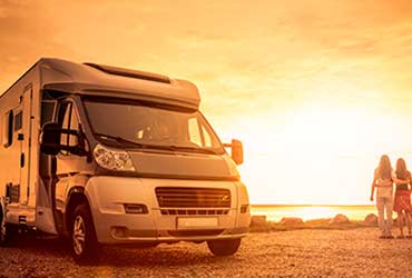 an RV parked on the side of the road.