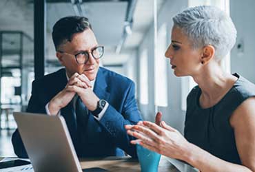 Two business employees in a meeting