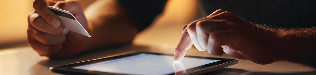 Person using tablet to search for information.