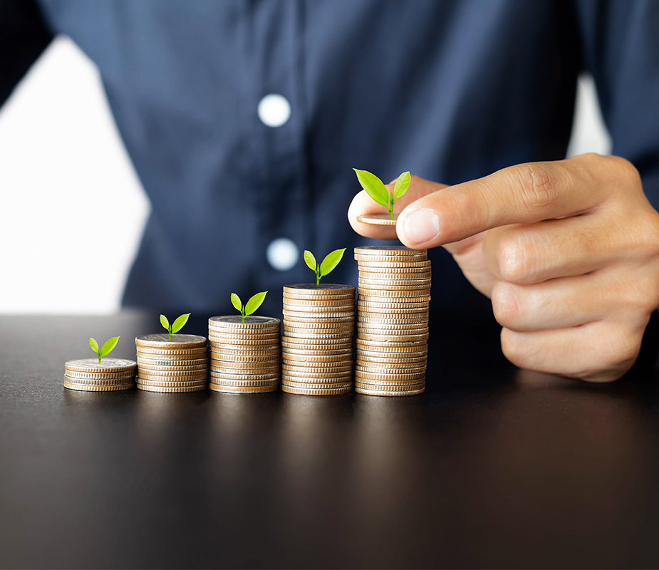 Stacking coins to symbolize growing finances